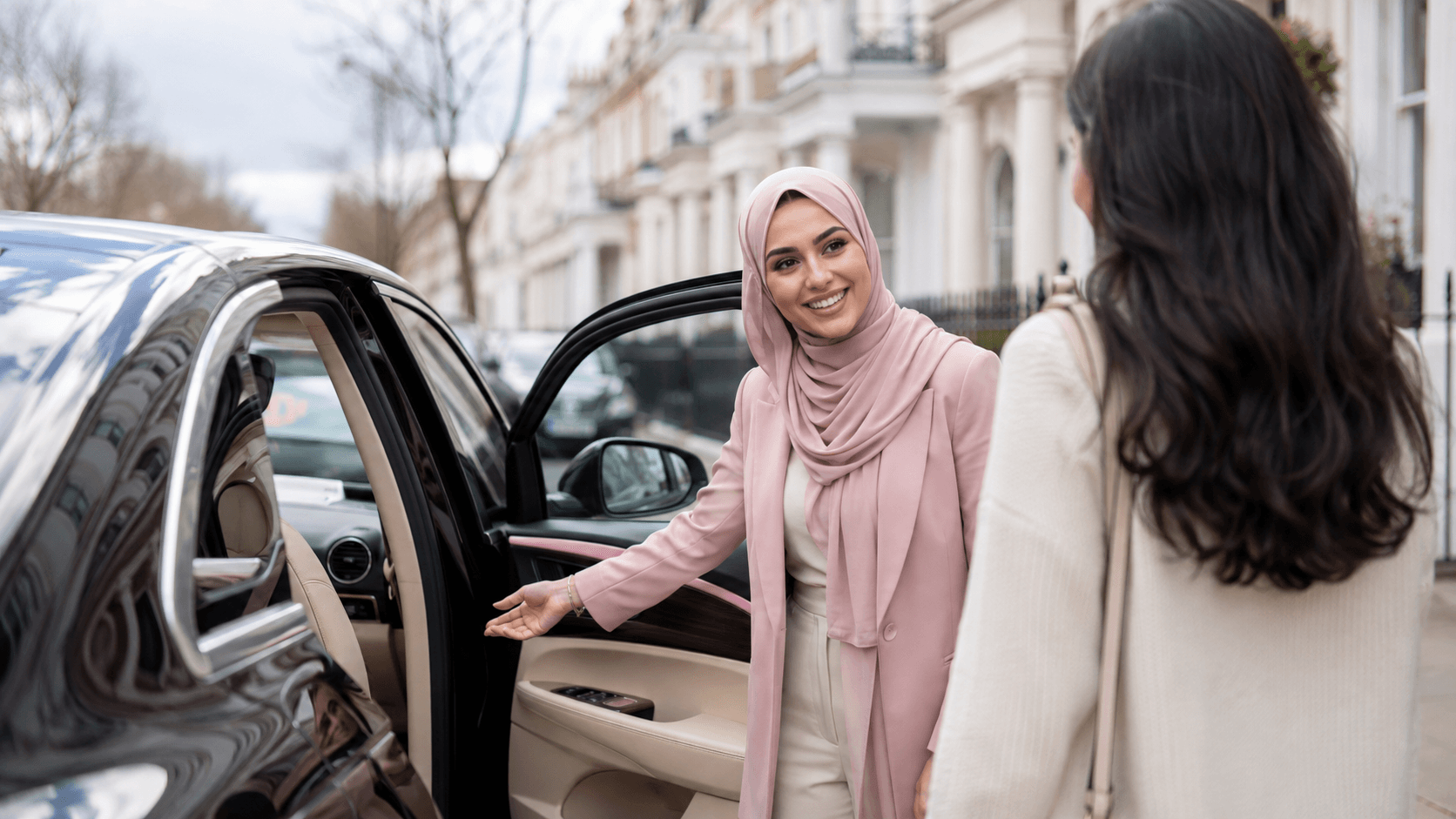 SheDrive driver welcoming a passenger into her car on a London street