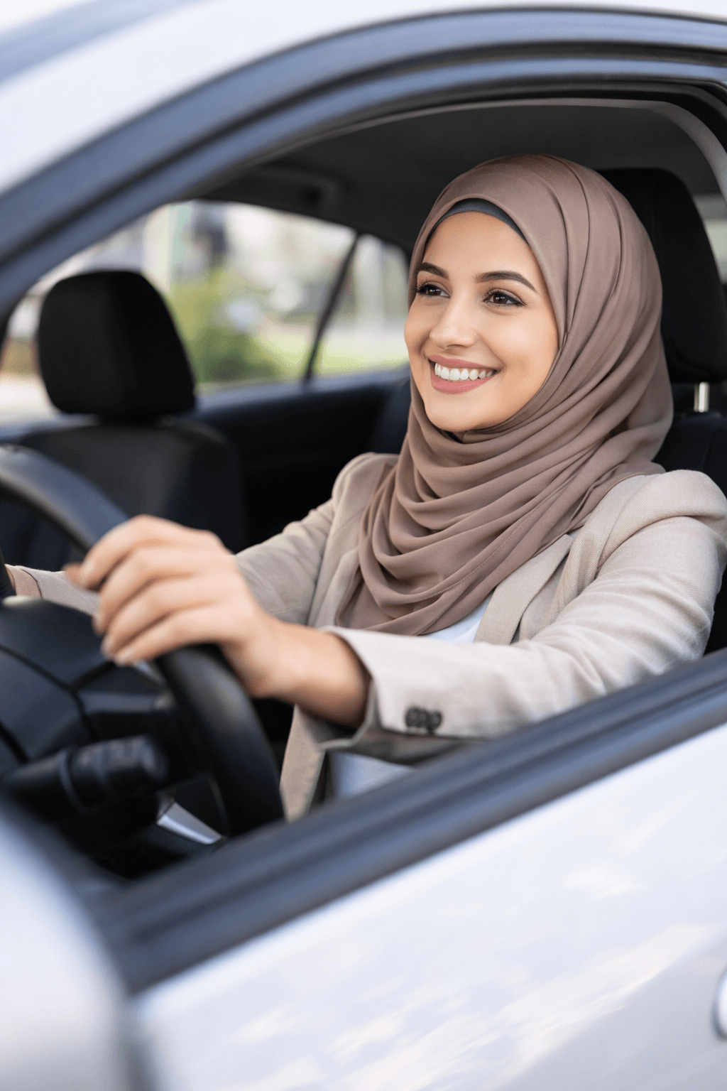 Woman driver smiling behind the wheel